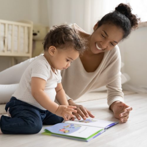mom playing on floor with baby now finally has energy after recovering from adrenal fatigue